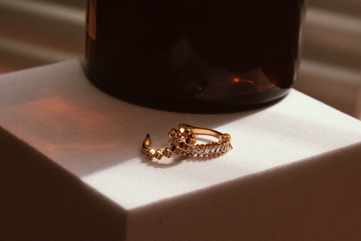A close-up of a delicate gold ring set with small stones